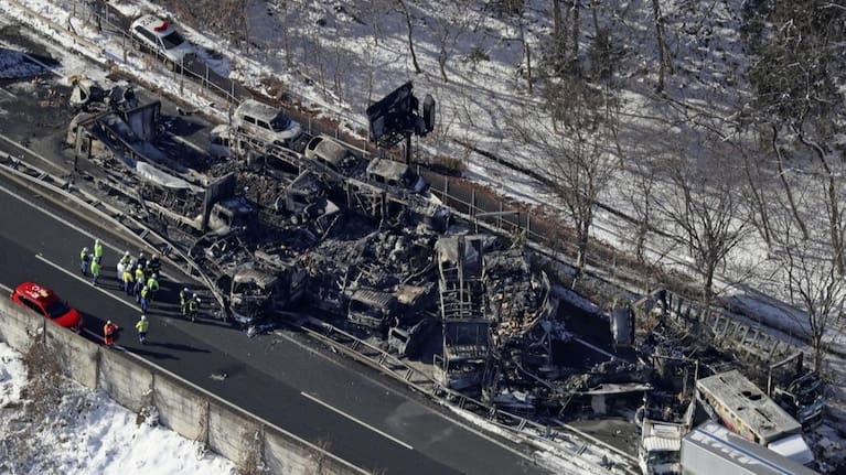Burnt vehicles are seen after a massive crash on an expressway in Minakami, northwest of Tokyo. (Source: Kyodo News via AP)