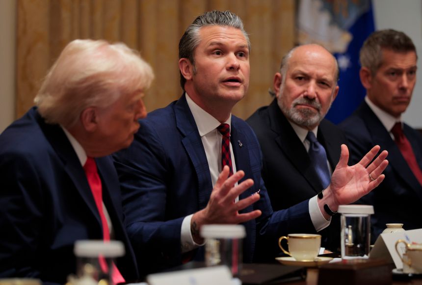 Secretary of War Pete Hegseth (center) speaks during a Cabinet meeting alongside (L-R) US President Donald Trump, US Secretary of Commerce Howard Lutnick and US Secretary of Transportation Sean Duffy in the Cabinet Room of the White House on December 2, in Washington, DC.