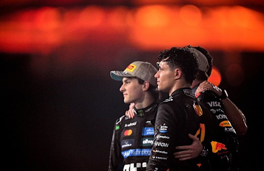 Oscar Piastri, Max Verstappen (obscured) and Lando Norris after the F1 season finale.