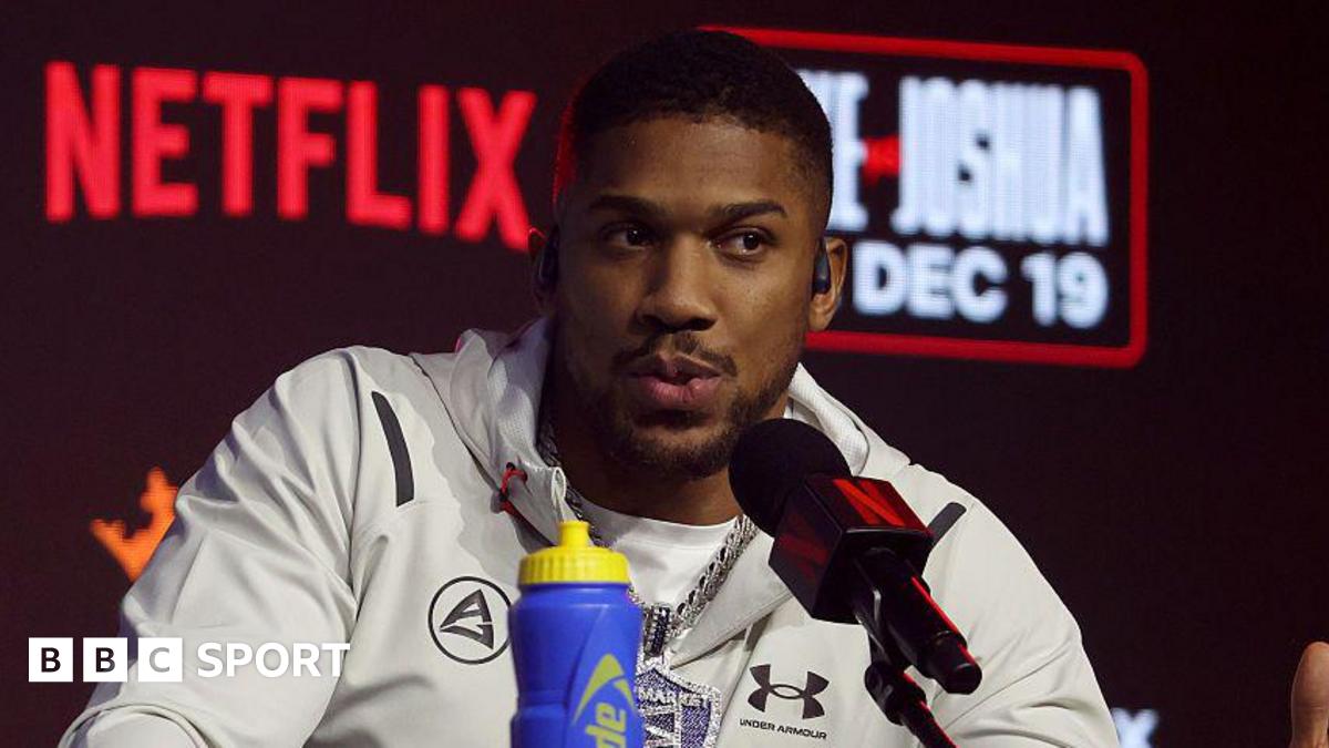 Anthony Joshua speaks at a news conference