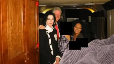 US Department of Justice Michael Jackson and Diana Ross are photographed with Clinton 