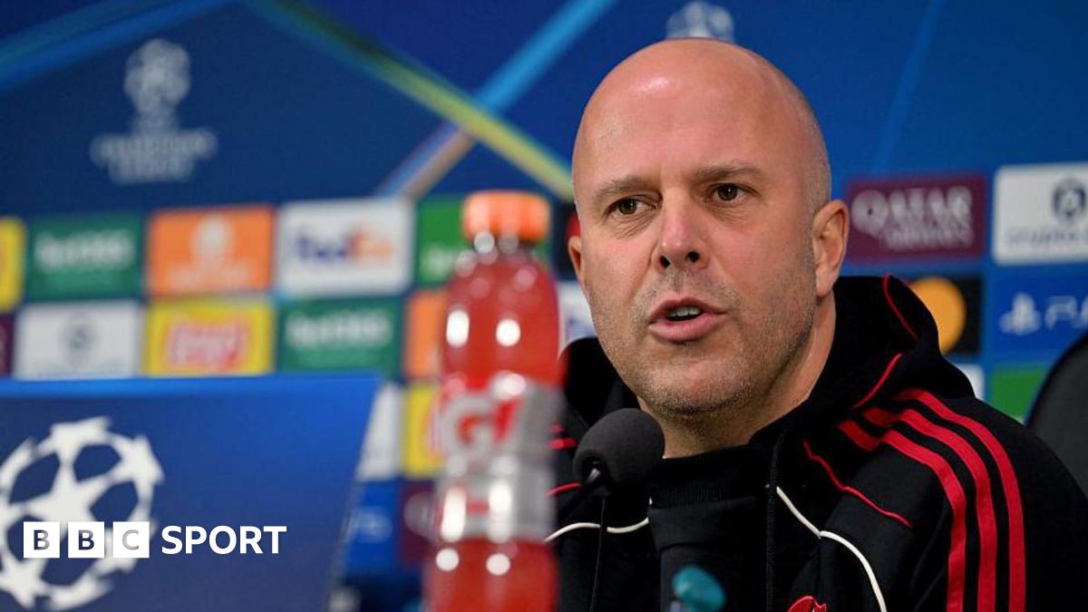 Arne Slot at a news conference for their Champions League game against Inter Milan