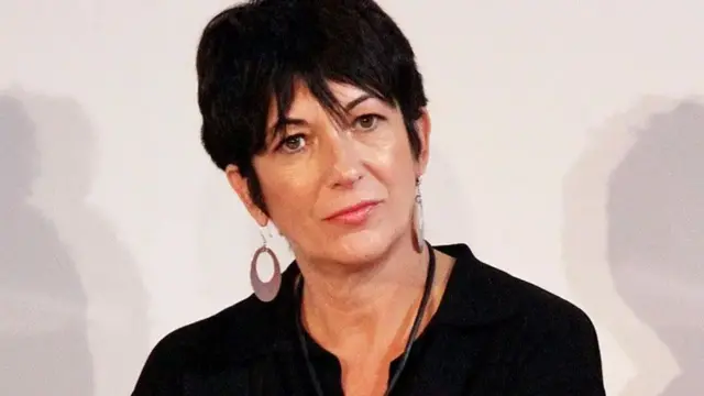 Ghislaine Maxwell looks contemplative wearing a black blouse and large earrings