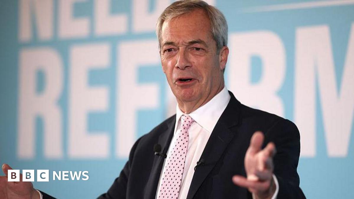 A photograph of Nigel Farage wearing a black suit and a pink tie. He is standing in front of a blue background and the words 'NEEDS REFORM' can be seen.