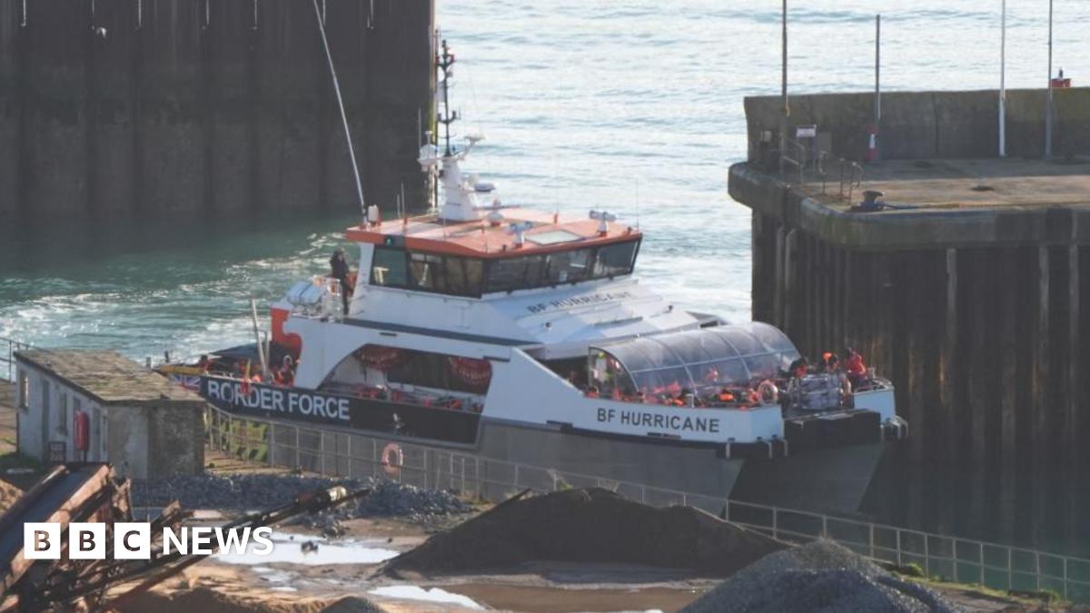 A group of people thought to be migrants are brought in to the Border Force compound in Dover, Kent, onboard a Border Force vessel.