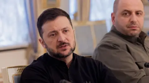 Getty Images Zelensky speaks during a meeting with some of his officials.