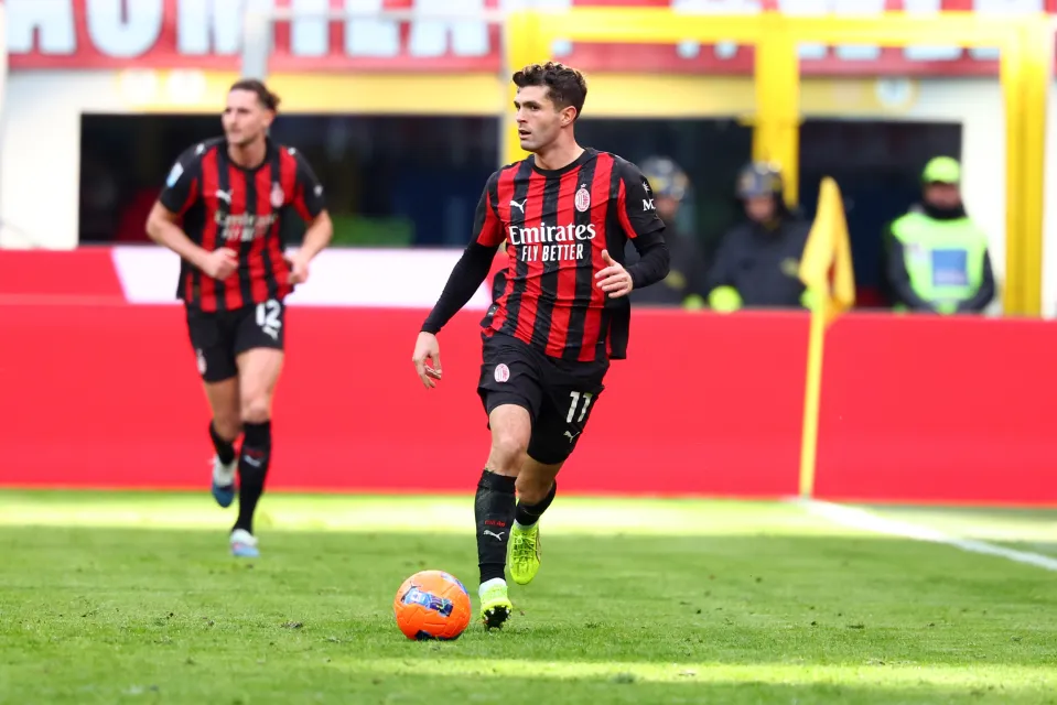 Christian Pulisic of AC Milan runs with the ball during the Serie A match between AC Milan and Hellas Verona FC at Giuseppe Meazza Stadium on December 28, 2025 in Milan, Italy. 