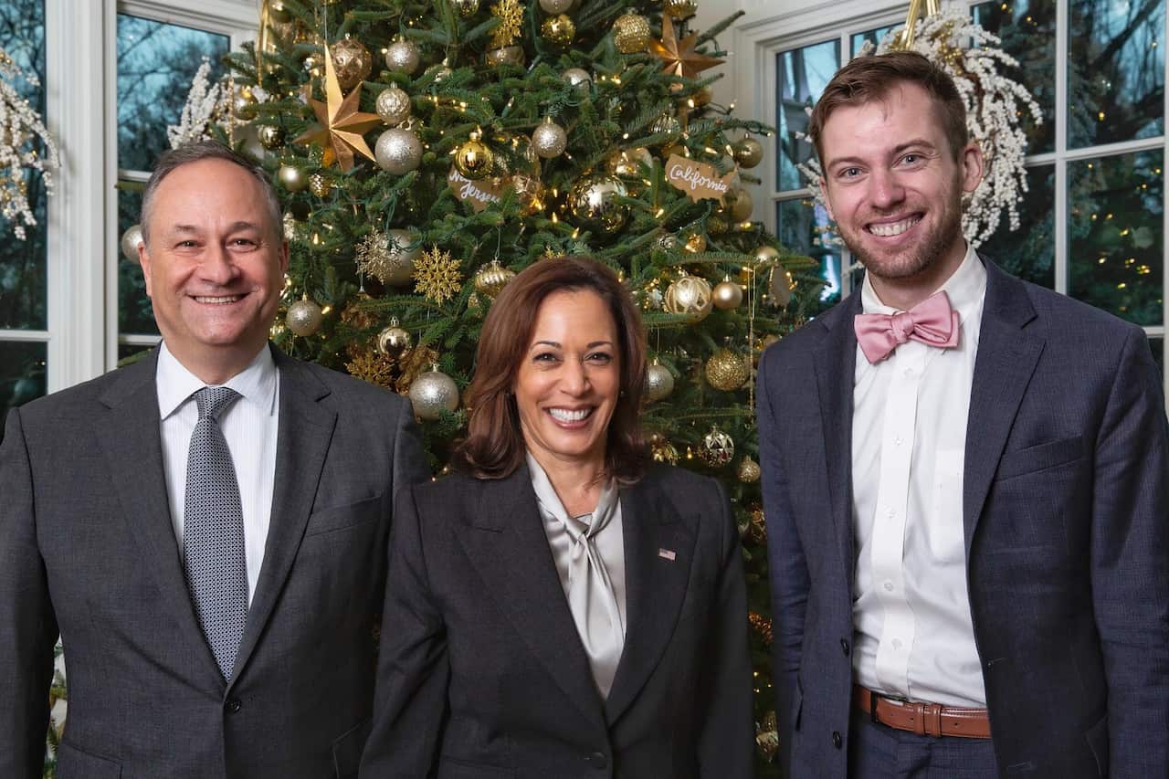 Cory Alpert with Kamala Harris and Doug Emhoff in front of a Christmas tree