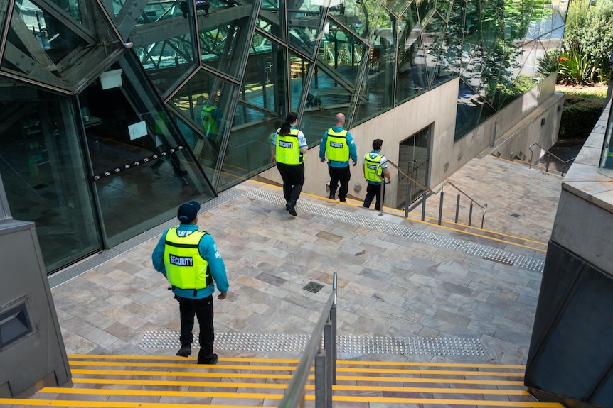 Security guards patrolling Fed Square