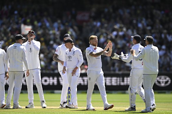 England celebrate a wicket at the MCG on Saturday.