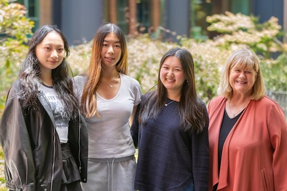 Camberwell Girls Grammar students (from left) Sunny Sun, Isabel Sootoh and Megan Chung with principal Debbie Dunwoody after receiving their results on Thursday.