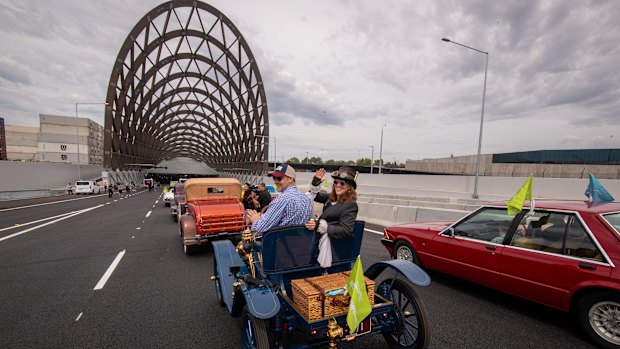 Louise Karch (right) in a vintage car that’s about to be driven through the tunnel.