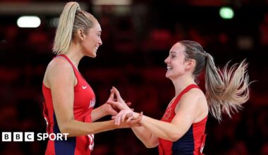 Natalie Metcalf and Helen Housby hold hands and celebrate