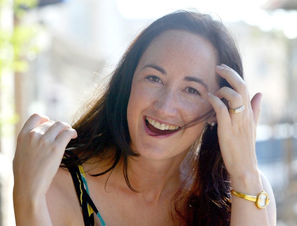 FILE -Author Sophie Kinsella poses on Wimbledon Village high street, London, Sept. 9, 2004