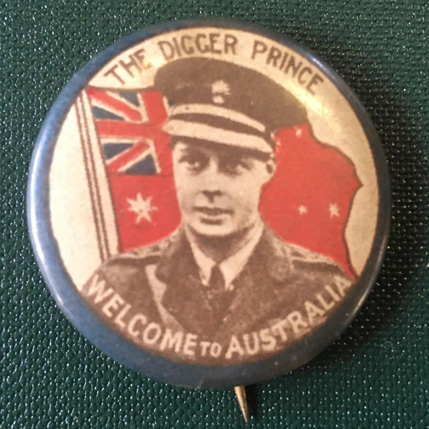 A badge saying "The Digger Prince Welcome to Australia" with a photo of Edward and a flag