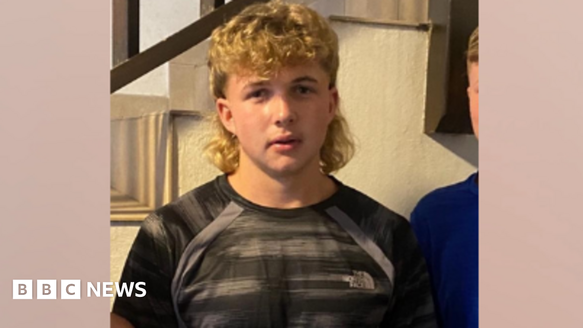 Sidney Brook, who has a blonde mullet haircut and brown eyes.