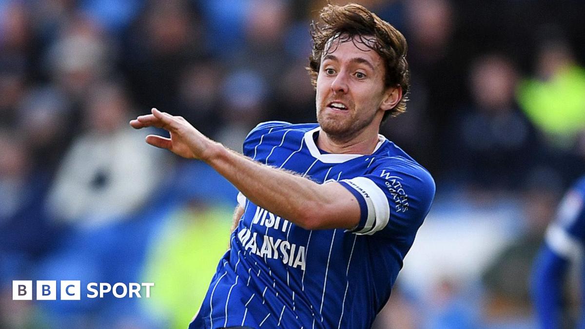 Ryan Wintle plays a pass for Cardiff against Huddersfield