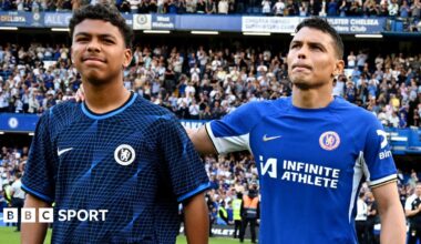 Thiago Silva of Chelsea shows appreciation to the fans with son Isago Silva at full-time after his final appearance