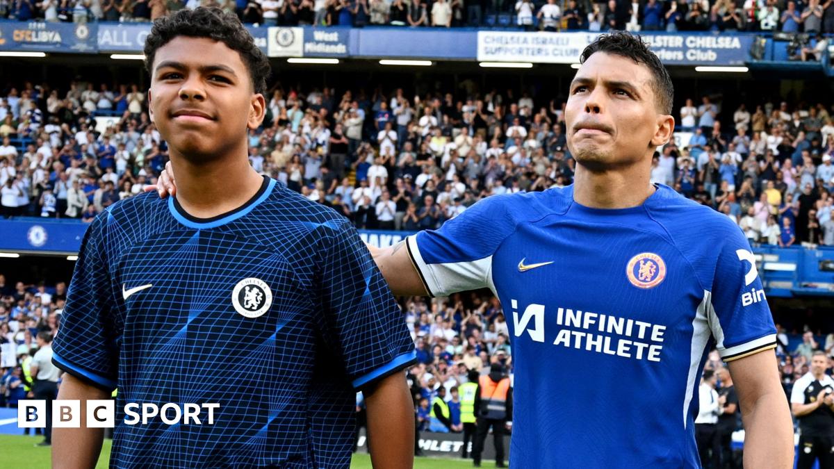 Thiago Silva of Chelsea shows appreciation to the fans with son Isago Silva at full-time after his final appearance