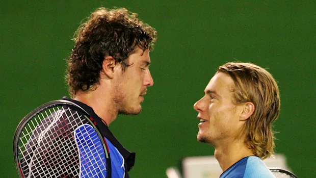 Marat Safin (left) is congratulated by Lleyton Hewitt after winning the 2005 Australian Open final.