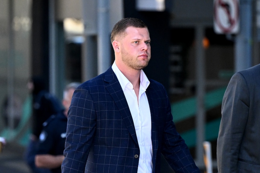 A man in a suit pictured outside Brisbane court