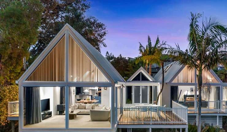 The distinctive waterfront house was designed by renowned Kiwi architect Ian Burrow and sold for just under $2m. Photo / Supplied