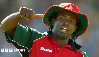 Douglas Hondo gives the thumbs in his red Zimbabwe kit during a one-day international
