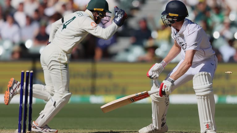 England's Zak Crawley reacts after he was out stumped by Australia's Alex Carey, left, during play on day four of the third Ashes cricket test between England and Australia in Adelaide, Australia.