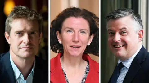 Getty Images A composite of Tristram Hunt, Annelise Dodds and Jonathan Ashworth. Hunt has short blonde-brown hair and is wearing a blue suit with white shirt open at the colour. Dodds has shoulder-length dark hair and is wearing a red coat with a spotted black and white top beneath. Ashworth has short grey and black hair. He is wearing a dark blue suit and tie with a striped white shirt. He is smiling widely.