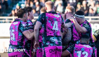 Ospreys players celebrate a try