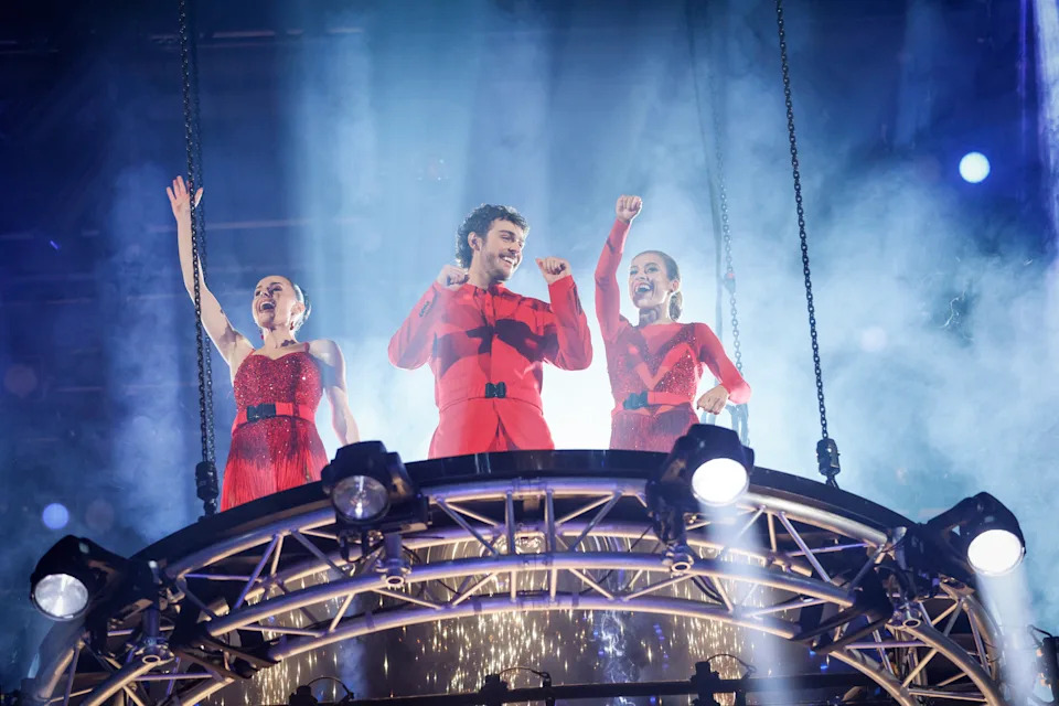 Amber Davies, George Clarke and Karen Carney made a grand entrance to the final. (BBC/Guy Levy)