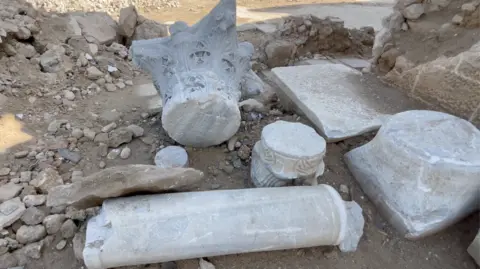 Damaged columns lie on the ground in the ruins of the Pasha's Palace in Gaza City, northern Gaza