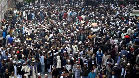 Reuters People gather to attend the funeral prayers for Bangladesh's former Prime Minister Khaleda Zia in Dhaka