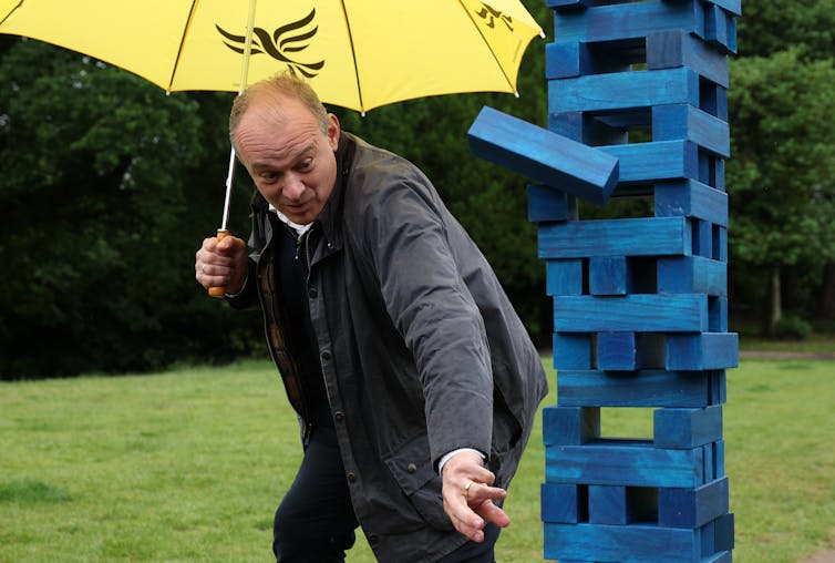 Ed Davey playing jenga