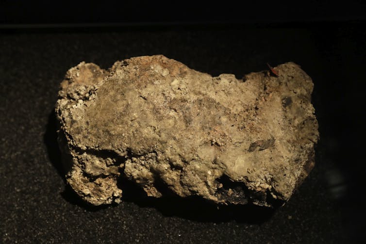 A huge brown lump that looks like a boulder.