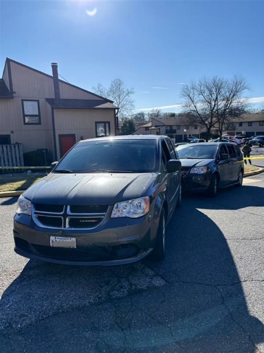 A photo shared by the Department of Homeland Security shows two dark minivans involved in Wednesday's shooting incident.