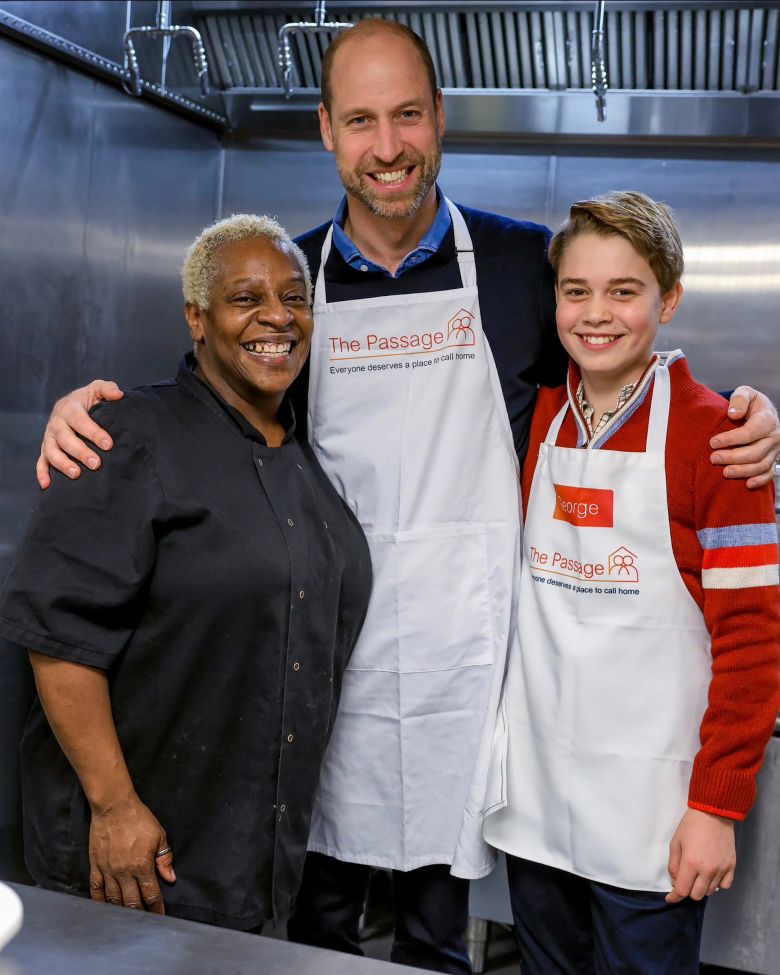 Prince William and his son George photographed alongside The Passage's head chef Claudette on Tuesday.