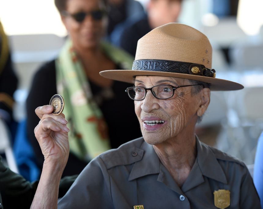 Betty Reid Soskin, a then-park ranger with the National Park Service, shows the replacement coin she received from Sally Jewell, then-US Secretary of the Interior, at the 72nd annual anniversary of the Port Chicago explosion at the former Naval Weapons Station in Condord, California, on Sunday July 17, 2016.