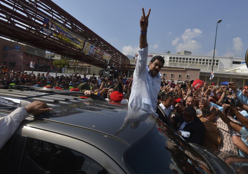 Maduro greets the people after a vote on April 14, 2013, in Caracas, Venezuela.