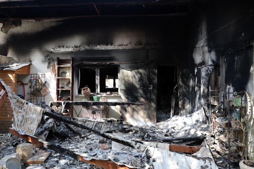 Charred remains of personal belongings lie inside the kibbutz Nir Oz along the border with the Gaza Strip on October 19, 2023, following the October 7 attack by Hamas-led militants.