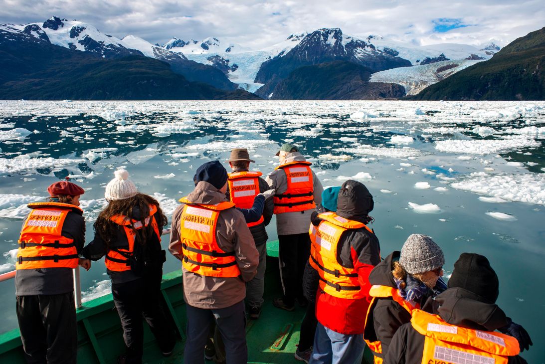 Tourists cruise past the Fjord Calvo near Puerto Natales, Chile.