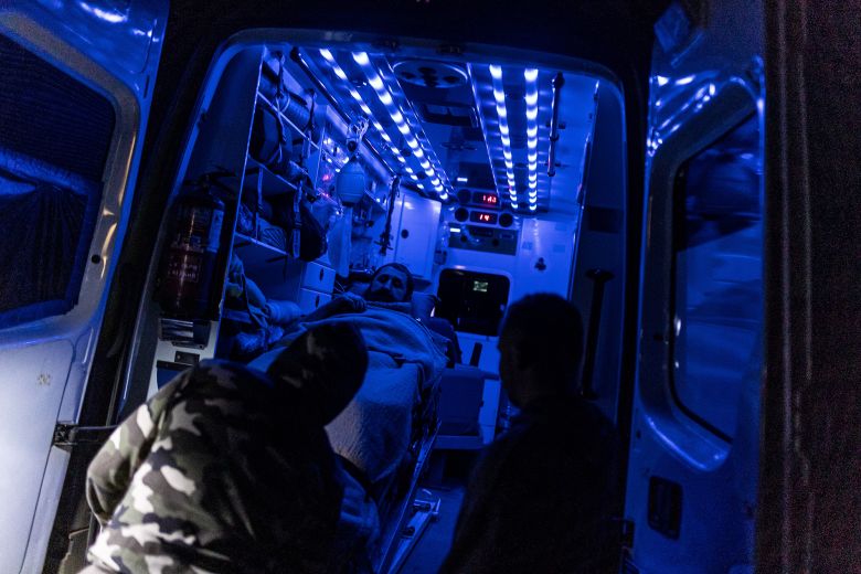 Ukrainian medics transfer a wounded Ukrainian soldier to an ambulance in the Siversk-Soledar area in May 2024.