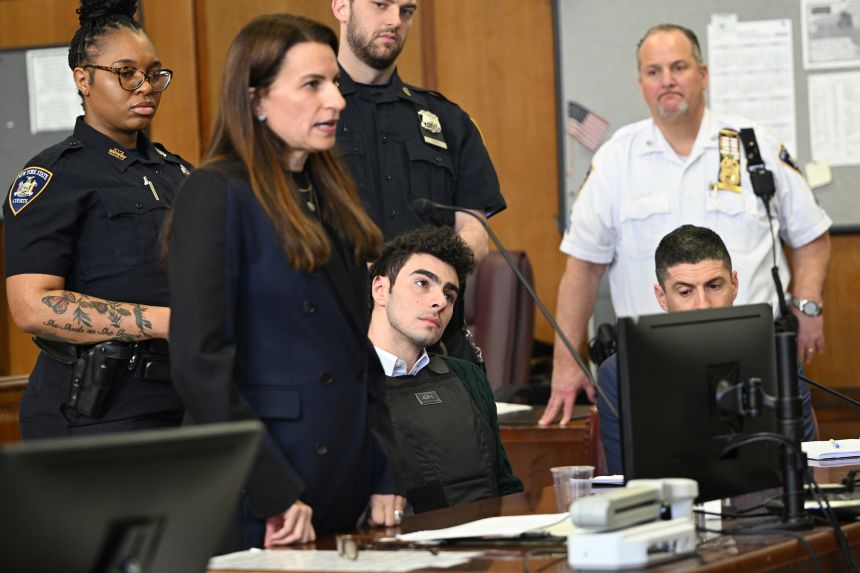 Luigi Mangione listens to his attorney Karen Friedman Agnifilo at a hearing in Manhattan Criminal Court on February 21.