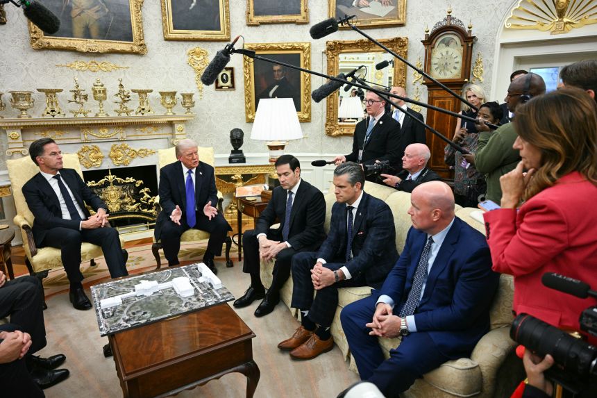 US President Donald Trump speaks to reporters as he meets with NATO Secretary General Mark Rutte in the Oval Office of the White House in Washington, DC, on October 22, 2025.