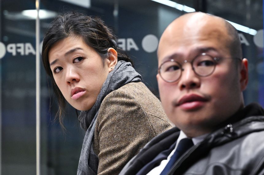 Lai's children, Sebastian Lai (right) and Claire Lai (left), during a visit to the office of Agence France-Presse (AFP) in Washington, DC on December 2, 2025.