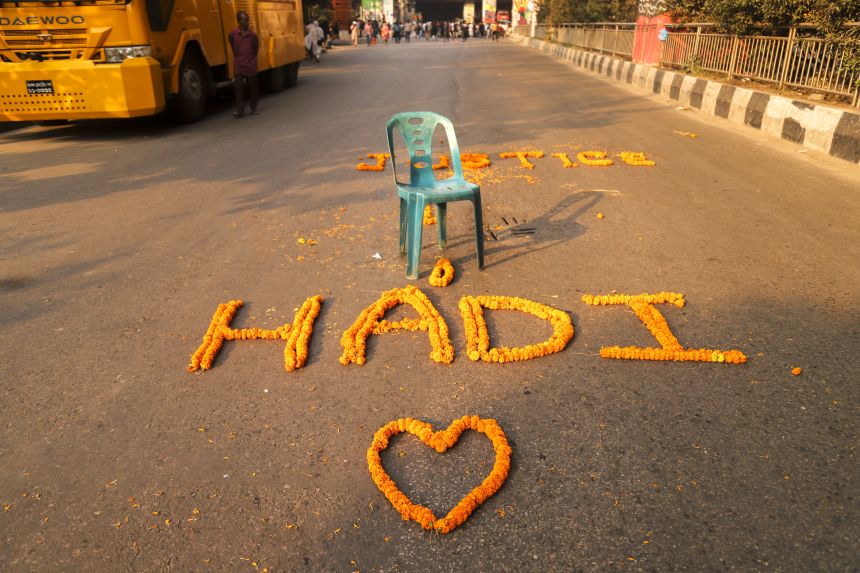 Activists block an intersection in Dhaka, Bangladesh, on December 15, 2025, demanding the arrest of those responsible for the attack on Sharif Osman Hadi.