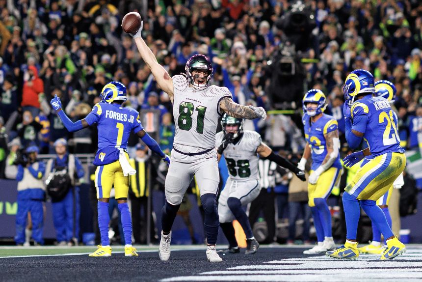 Eric Saubert celebrates after scoring the winning two-point conversion in overtime against the Los Angeles Rams on Thursday Night Football.