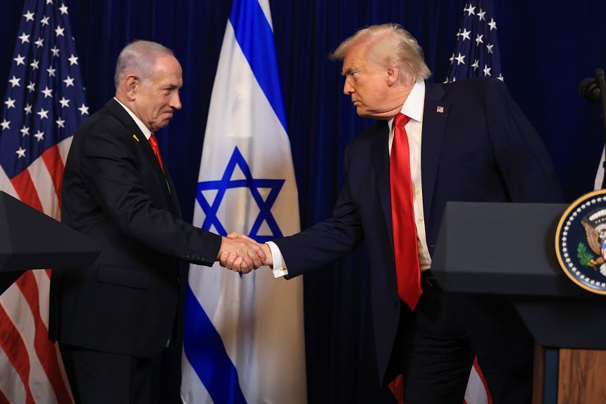 US President Donald Trump shakes hands with Israeli Prime Minister Benjamin Netanyahu during a press conference at his Mar-a-Lago club in Palm Beach, Florida on December 29, 2025.
