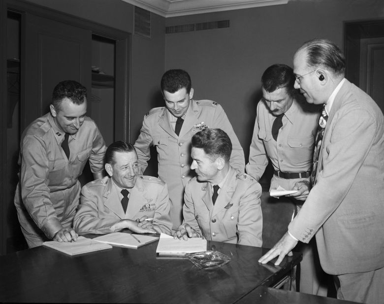 Capt. Edward Ruppelt, stood in the middle, is shown at a news conference in July 1952 with other Air Force officials after 