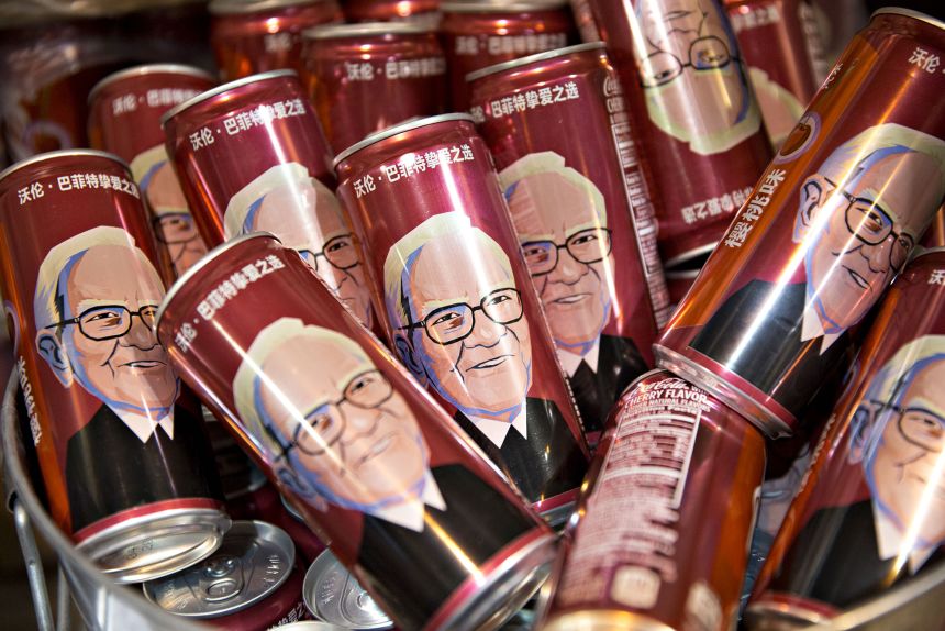Cans of Coca-Cola Co. bearing a likeness of Warren Buffett sit in a bucket during a shareholders shopping day ahead of the Berkshire Hathaway annual meeting in Omaha in 2017.